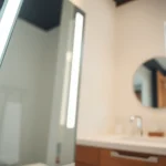 Transform your space with a stylish mirror and LED lights for a bright, modern look.