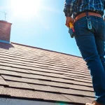 Roofing company expert installing shingles on a house, showcasing craftsmanship and quality service.